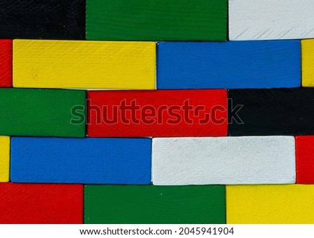 Stack of colorful wooden cuboid shape perfect for background.