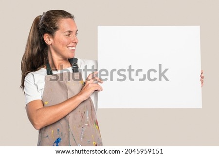 Female artist showing a white canvas with design space