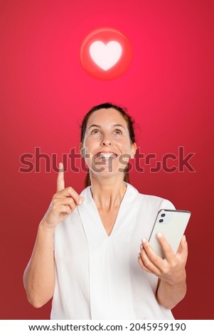 Happy woman using a dating app on her phone