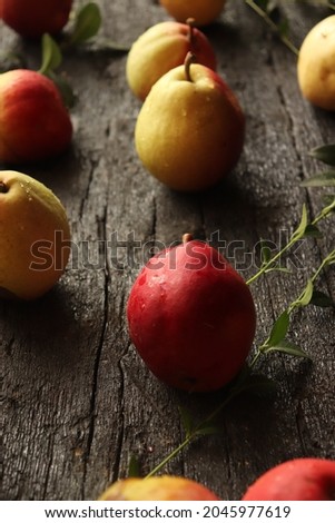 sweet and fragrant autumn pears on rustic black wooden table