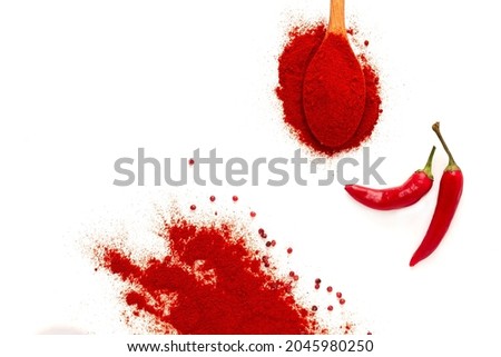 Hot red pepper, spoon, chili powder, pepper sauce, on a white background, selective focus, no people, horizontal, 