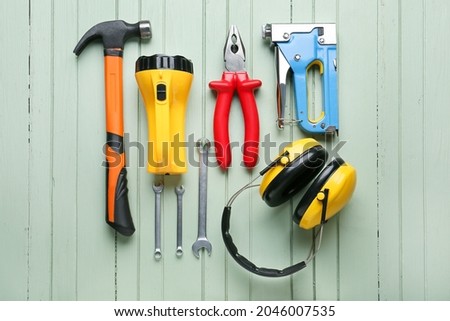 Safety equipment on color wooden background