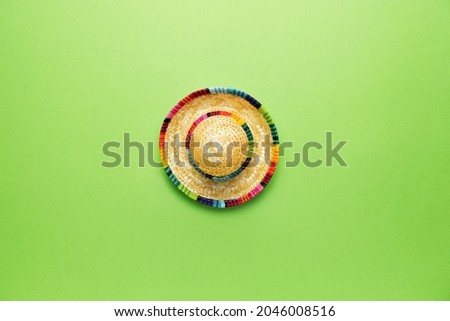 Mexican sombrero on color background Royalty-Free Stock Photo #2046008516