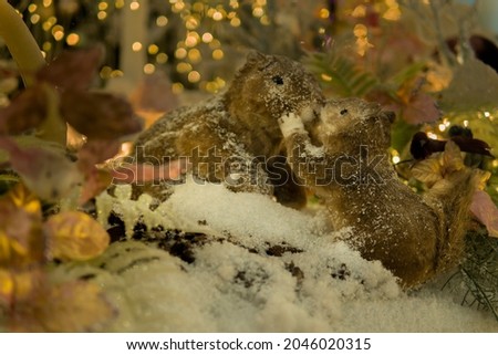 puppet squirrels kiss in a fairy snowy forest. Christmas installation.