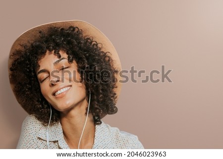 Woman wearing earphones background remixed media