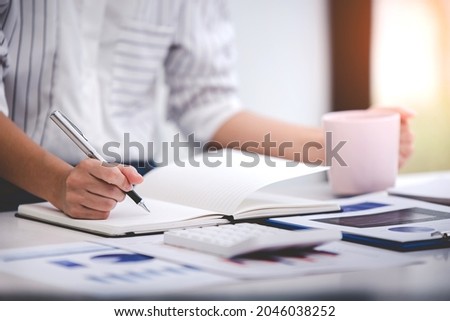 business woman working in business office on the desk