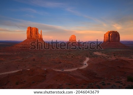 beautiful scenic sandstone buttes with sunrise sky, Monument Valley, Landmark of Arizona Utah border.