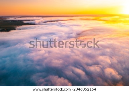 Picturesque scene of plain in the fog from a bird's eye view. Location place Dniester canyon, Ukraine, Europe. Aerial photography, drone shot. Perfect natural wallpaper. Discover the beauty of earth.