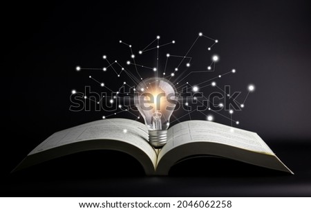 Light bulbs and books. Concept of reading books, knowledge, and searching for new ideas. Innovation and inspiration, Creativity with twinkling lights, the inspiration of ideas. Royalty-Free Stock Photo #2046062258