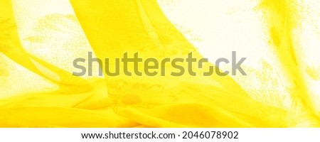 yellow silk fabric with painted meadow flowers, floral background. Many pale flowers in a colorful composition. Background texture