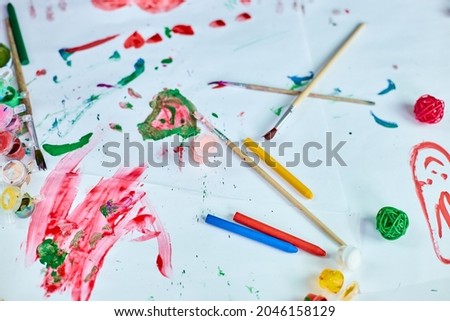 Top view of painted colorful watercolor accessories at the table, Art school concept,