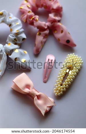 Various hair accessories in pastel and gold tones. Selective focus.