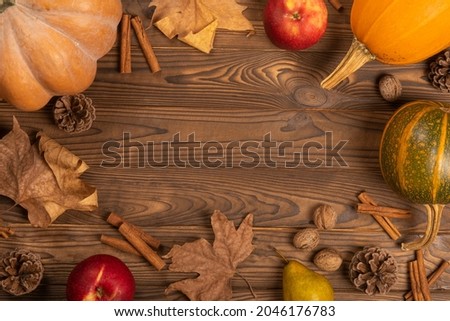 copy space,pumpkin decor, wooden background, composition for a photo, cinnamon, leaves, background for an inscription, background for a presentation, Royalty-Free Stock Photo #2046176783