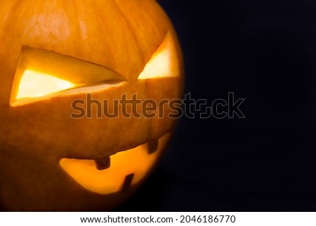 Pumpkin on a black background close up