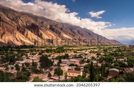 Panoramic sided view of the little town of Maimará, Jujuy Argentina at the afternoon. The main Church can be seen below. Quebrada de Humahuaca. Unesco world´s heritage Royalty-Free Stock Photo #2046205397