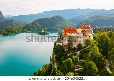 Aerial view of mediaeval Bled castle on the cliff of the mountain under lake Bled with turquoise blue water in Slovenia Royalty-Free Stock Photo #2046345221