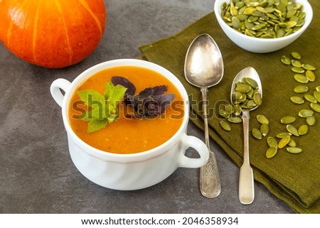 Bowl of pumpkin soup. Close up