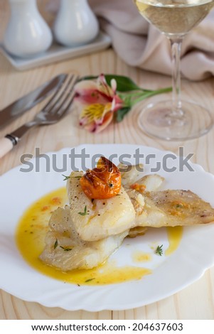 Baked cod under oil sauce