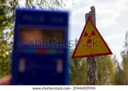 Radiation. Danger. Radiation measurement with a dosimeter. A sign of radiation. Passage is prohibited.