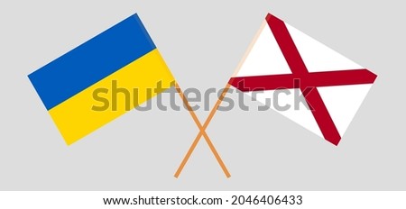 Crossed flags of Ukraine and The State of Alabama. Official colors. Correct proportion