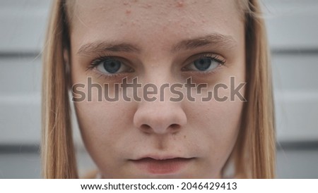 Portrait of a blonde teenage girl. Face close-up.