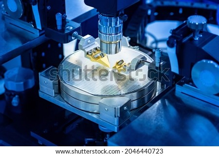 Close up of examining of test sample of microprocessor. Microchips transistor under microscope. Equipment for testing microchips and PCB. Automation of PCB production. Manufacturing of microchips. Royalty-Free Stock Photo #2046440723