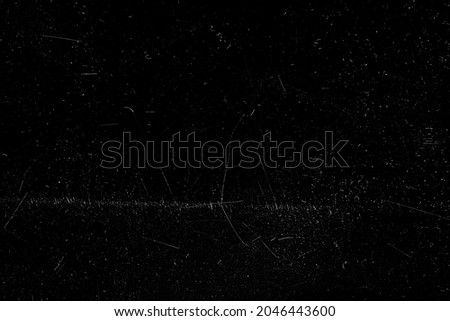 High resolution scratches on plastic or photo overlay. Texture mock up grunge on black background. Dirty grain dust film frame photo effect template.
