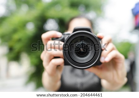 Photographer takes pictures in the open air