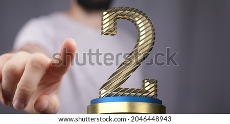 A 3d rendering of a finger pointing at a second-place award on a gray background