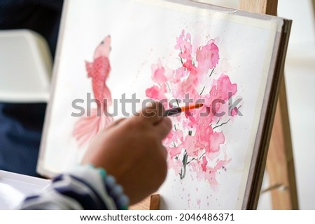 Watercolor drawings creation at painting art classes. (Pink Flower  Painting)