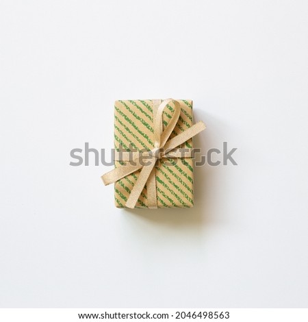 Green stripe pattern brown gift box isolated on white background. top view, copy space