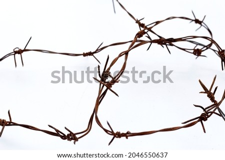 Rusty barb wire isolated on white background