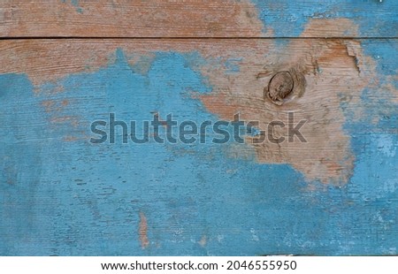 Old Vintage blue painted wood background with peeling paint