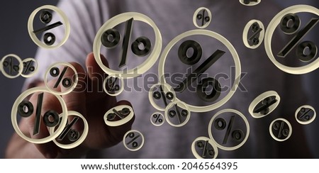 A 3D rendering of percent icons with a hand touching it from the background- concept for percentage of online sales