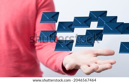 A female hand presenting email icons in the air