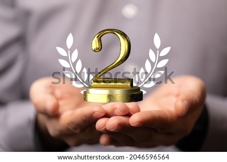 A 3D rendering of a digital number 2 with wheat grains on human hands- concept for 2nd place or 2nd year anniversary Royalty-Free Stock Photo #2046596564