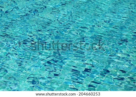 beautiful clear blue swimming pool on a sunny afternoon  