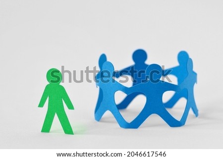 Group of people holding hands in circle and person alone - Concept of social exclusion and isolation Royalty-Free Stock Photo #2046617546