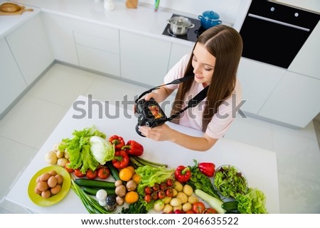 Top above high angle view portrait of attractive long-haired girl cooking food making photo post at home light white kitchen indoors