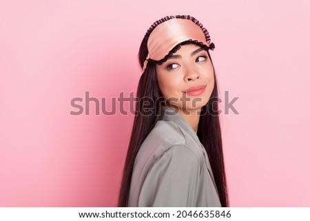 Profile side view portrait of attractive pensive girl looking aside copy blank space isolated over pink pastel color background