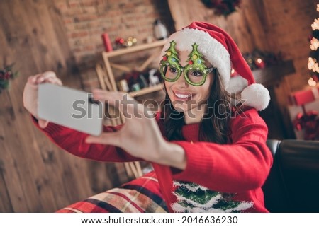 Photo of cute funky woman dressed print pullover headwear glasses tacking photo modern gadget indoors room home house