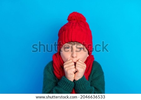 Photo portrait little boy wearing red headwear scarf trembling on frost isolated bright blue color background