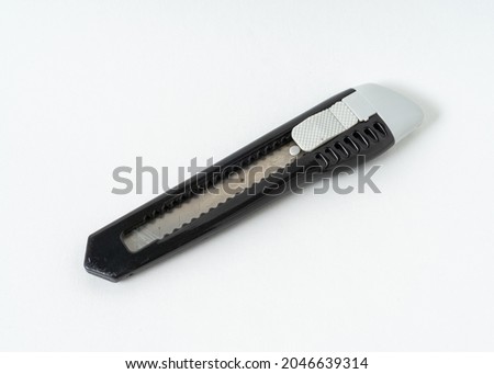 Stationary pen knife isolated on white background.