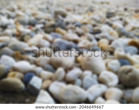 defocused abstract background of stones or gravel