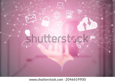 Businessman line connecting icons applications of communication icon on the pink background, Image of the globe on the palm of businessman. Media technologies, Cloud Computing, Mail, smartphone.