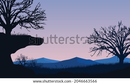 A realistic panorama of mountains silhouettes with dry trees in the morning from the edge of the city. Vector illustration of a city
