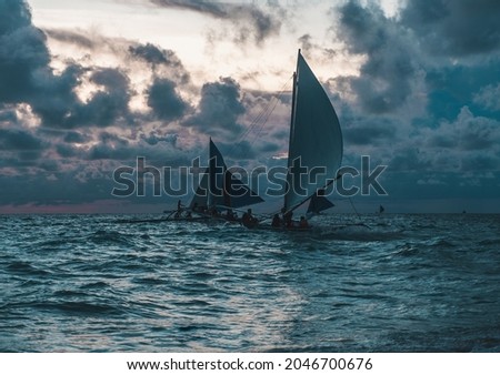 Scenic photo of sailboats in the ocean. Picturesque picture of two sailing ships in the sea. Blue colours