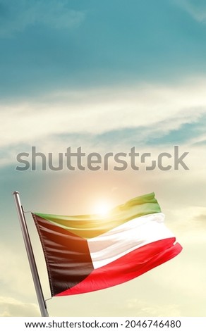 Kuwait national flag waving in beautiful clouds. Royalty-Free Stock Photo #2046746480