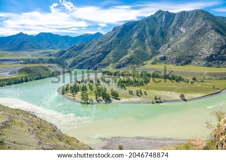 Confluence of the rivers, the turbid milk water of the Chuya and the turquoise Katun in Chui-Oozy park, Ongudai district of the Altai Republic, Russia Royalty-Free Stock Photo #2046748874