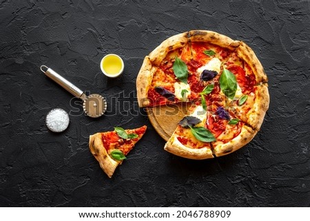 Pizza slices with tomatoes cheese and basil, top view